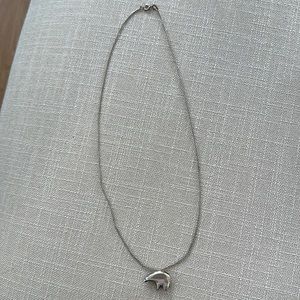 Silver polar bear on a silver beautiful necklace.